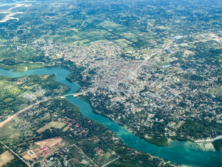 aerial landscape view of area around City of Mtwapa in Kenya, located north of Mombasa at east coast on Indian Ocean and Mtwapa Bridge crossing the Mtwapa Creek and cityscape from bird eyes view 
