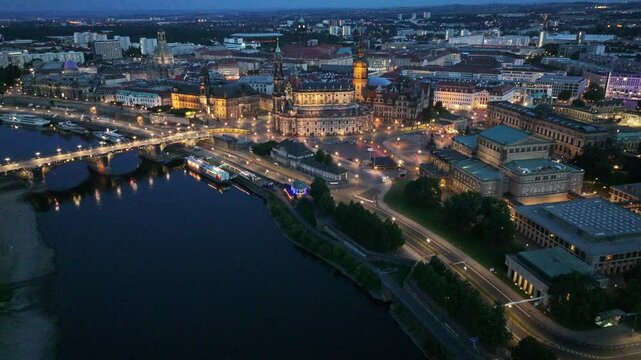 Dresden, Saxony, Germany, aerial night video footage, flying along River Elbe to Historic District in Dresden with Cathedral, Semper Opera, "Church of our Lady" and many other famous buildings
