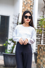 Young Woman in White Long Sleeve Shirt and Glasses Posing for Outdoor Mockup