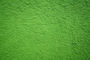 Fototapeta premium Background of painted rough stucco green wall Wide-Angle