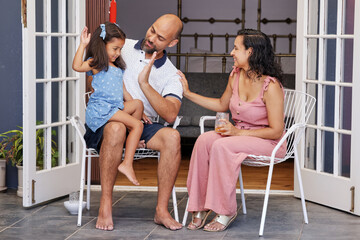 Family relaxing on patio
