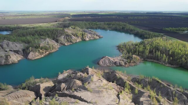 View of the Romantsev hills and lakes in the Tula region near Konduki village. Flooded quarries. Natural and anthropogenic recreational complex Romantsev mountains. Tourist location. 4k footage