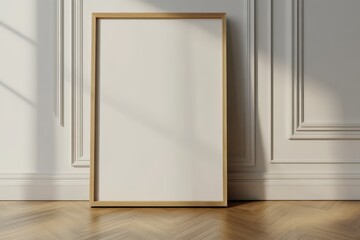 A simple and minimalist interior with a wooden-framed blank canvas leaning against a white wall