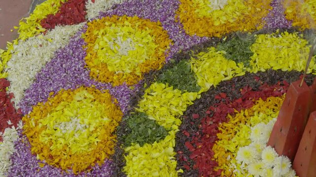 pookalam during Onam festival in Kerala, India
flower decoration activity during onam days called athapookalam decoration