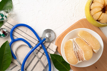 Fresh pomelo fruit and medicine adverse drug reaction interaction design concept.