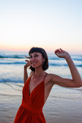 Portrait of a happy girl enjoying summer holidays on the beach.