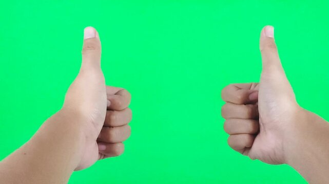 Double thumb up gesture isolated on green screen chroma key