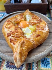 Georgian khachapuri food, with butter, cheese and egg
