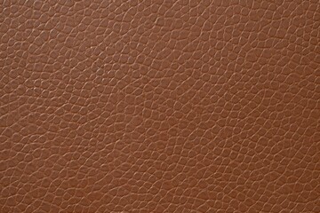 Fototapeta premium Brown leather texture in close-up with grain details, natural surface, and visible pores for fashion background