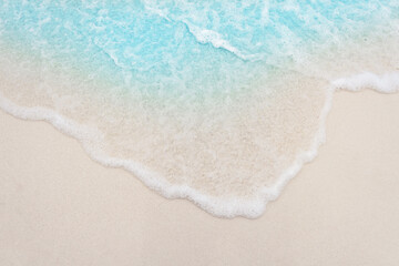 wave on luxury white sand beach, top view, closeup
