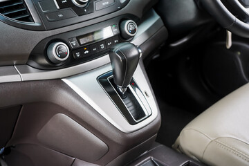 automatic transmission shift selector in the car interior. Closeup a manual shift of modern car gear shifter. 4x4 gear shift