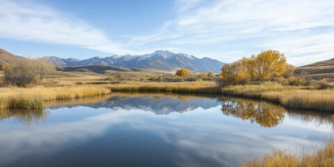 Fototapeta premium Tranquil Lake Surrounded by Majestic Mountains Under a Clear Blue Sky, Capturing the Serenity of Natures Breathtaking Landscape
