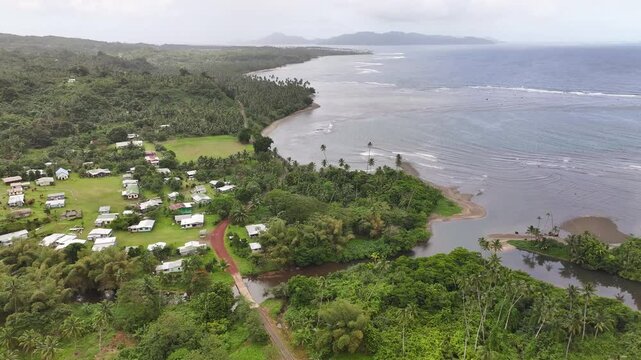 Bouma Coastal Village And Tavoro Creek At Taveuni Island In Fiji. - aerial shot