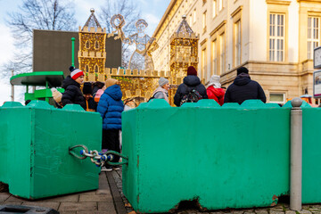 Colorful concrete safety barriers blocks protecting public holiday Christmas market against terror...