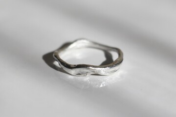 Handmade silver ring with elegant design on a white background. Handcraft precious item. Jewelry accessories.