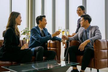 White collar workers are celebrating at office.