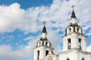 Obraz premium The two tall white towers are topped with crosses