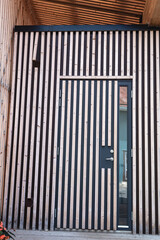 Doors with vertical wooden slats. Travel.