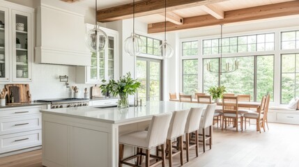 A large, open kitchen with a central white island, featuring glass pendant lights above