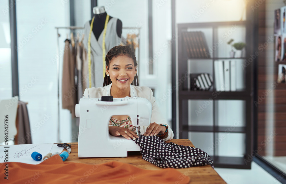 Poster Happy woman, portrait and fashion designer with sewing machine for garment, clothing production or manufacturing at workshop. Female person, seamstress or dressmaker with smile for handmade fabric