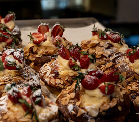 Delicious freshly baked custard and strawberry almond Danish pastries.
