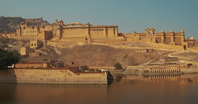 Jaipur, Rajasthan, India. Panoramic View Of Amber Fort And Maota Lake. Wall And Towers Of Amer Fort Or Amber Fort, Amer Situated On Forested Hill. Amer Palace Is Great Example Of Rajput Architecture
