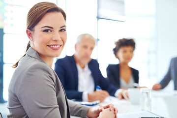 Woman, office and happy in meeting for portrait with confidence for planning and brainstorming. Female person, employee and smile with pride at boardroom for teamwork or collaboration on strategy