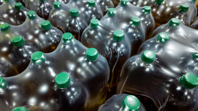 Plastic bottles bundled together in shrink wraps, highlighting packaging solutions and recycling during Earth Day awareness
