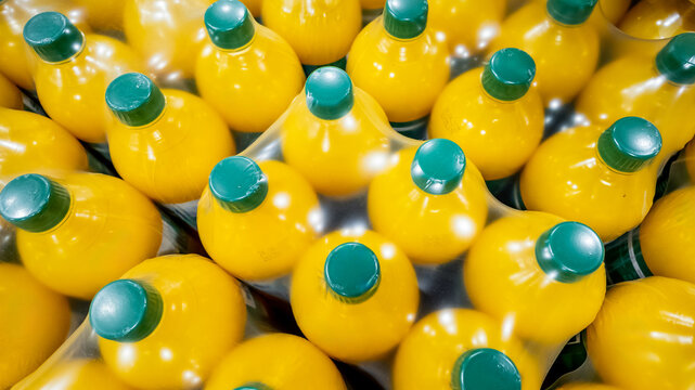 Multipack of orange juice bottles representing convenience and bulk buying for home stock and healthy living concepts