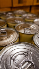 Close-up of stacked canned food in a warehouse, depicting concepts of food supply and emergency preparedness