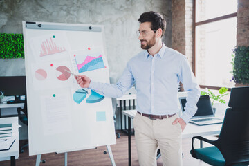 Photo of successful elegant man whiteboard presentation wear shirt loft interior modern office...