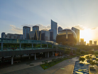 Fototapeta premium Modern City Skyline at Sunset with Architectural Marvels