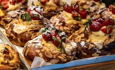 Delicious freshly baked custard and strawberry almond Danish pastries.