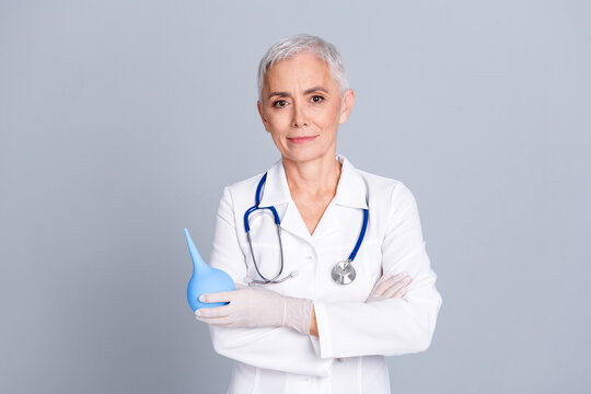 Photo of attractive doctor woman specialist therapist wear white robe hold old enema therapy isolated on grey color background