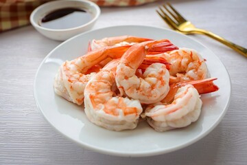 Boiled shrimp in white ceramic plate on white background 