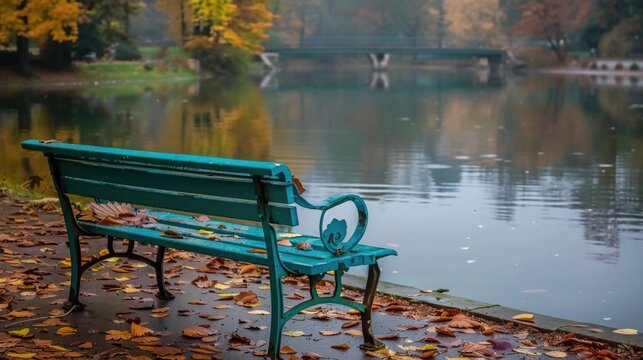 Empty Green Park Bench by Lake with Autumn Trees Reflection Peaceful Scene - Powered by Adobe