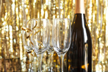 a bottle of champagne and glasses for champagne for christmas, new year, party, wedding celebration...