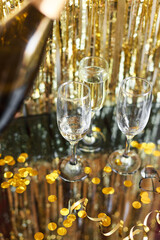a bottle of champagne and glasses for champagne for christmas, new year, party, wedding celebration...