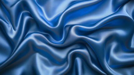 Obraz premium Elegant blue satin fabric with soft folds and a luxurious sheen, perfect for design projects, fashion, or textile backgrounds.