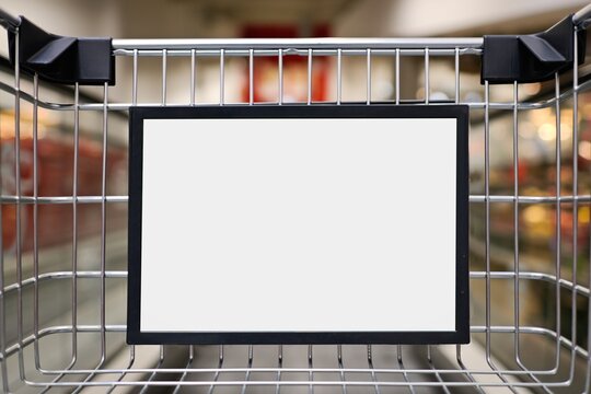 Advertising sign in a Shopping cart. Horizontal image with copy space and bokerh background. 