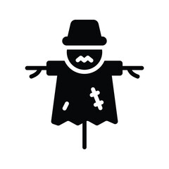 A scarecrow, protecting the garden from birds and pests