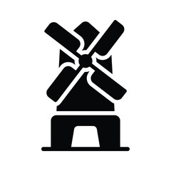 A windmill, harnessing wind power and adding charm to the garden