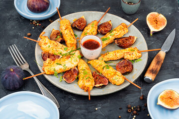 Grilled chicken on bamboo skewers.