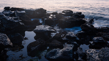 Rock formation on the beach shore.