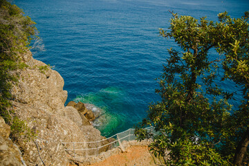 Seascape with rocks and yachts on the sea. Portofino, resort. Ligurian Sea. Italy