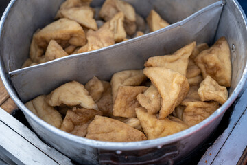 Fried Tofu Pieces in a Metal Container