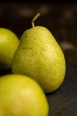 a green ripe pear on the table