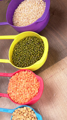 Assorted different types of beans and cereals grains. Set of indispensable sources of protein for a healthy lifestyle. Everyday use at Indian households.
