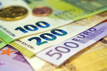 Euro banknotes. Real euro money of various colors and nominals and metal coins