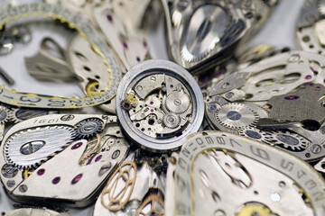 Old mechanical watches with gears and cogs. Watch or clock mechanisms